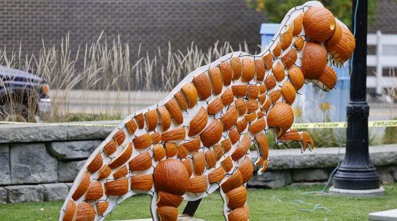 Pumpkin art is on display for Operation Pumpkin Thursday, Oct. 6, 2022 at Rotary Park in downtown Hamilton. NICK GRAHAM/STAFF
