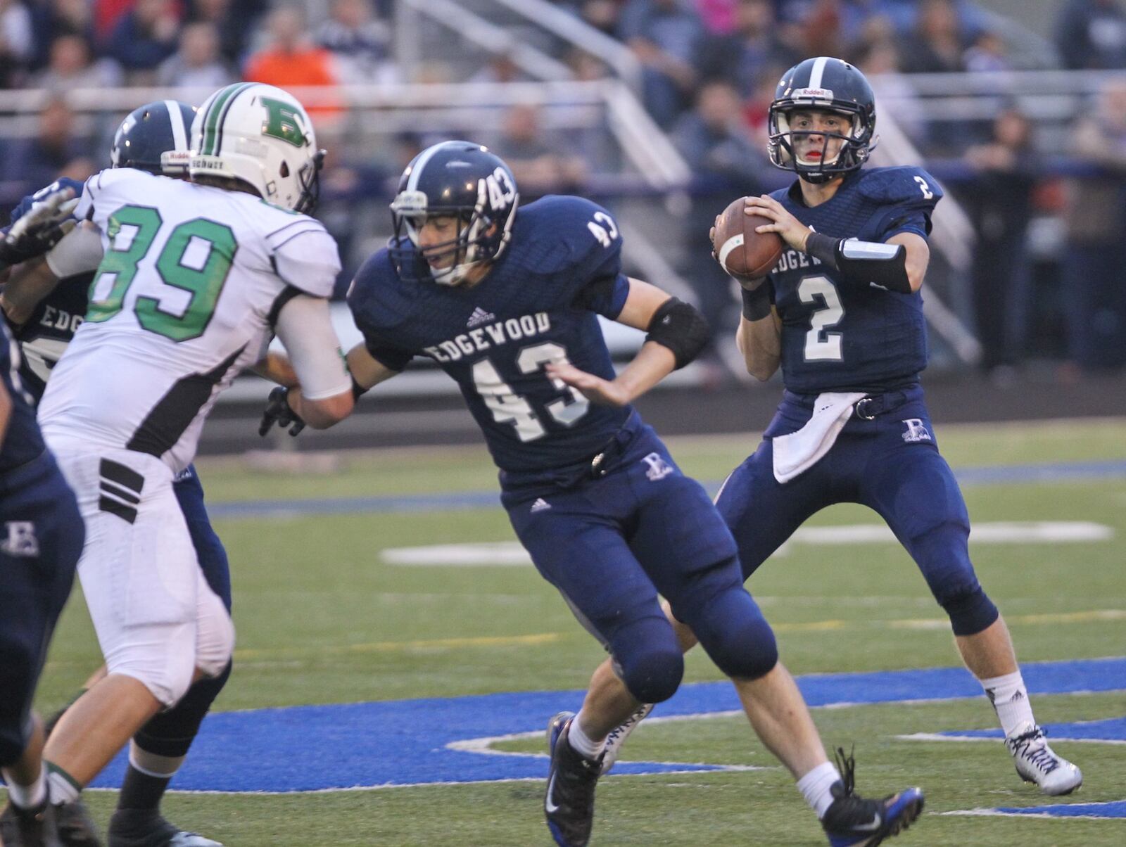 Edgewood quarterback Trace Reynolds (2) drops back to pass against Badin on Sept. 12, 2014, at Kumler Field in St. Clair Township. The visiting Rams won 42-7. GREG LYNCH/STAFF