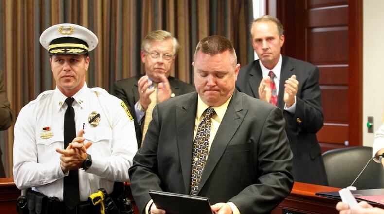 Hamilton Police Officer Chad Stafford receives the Medal of Valor in May 2014. STAFF PHOTO