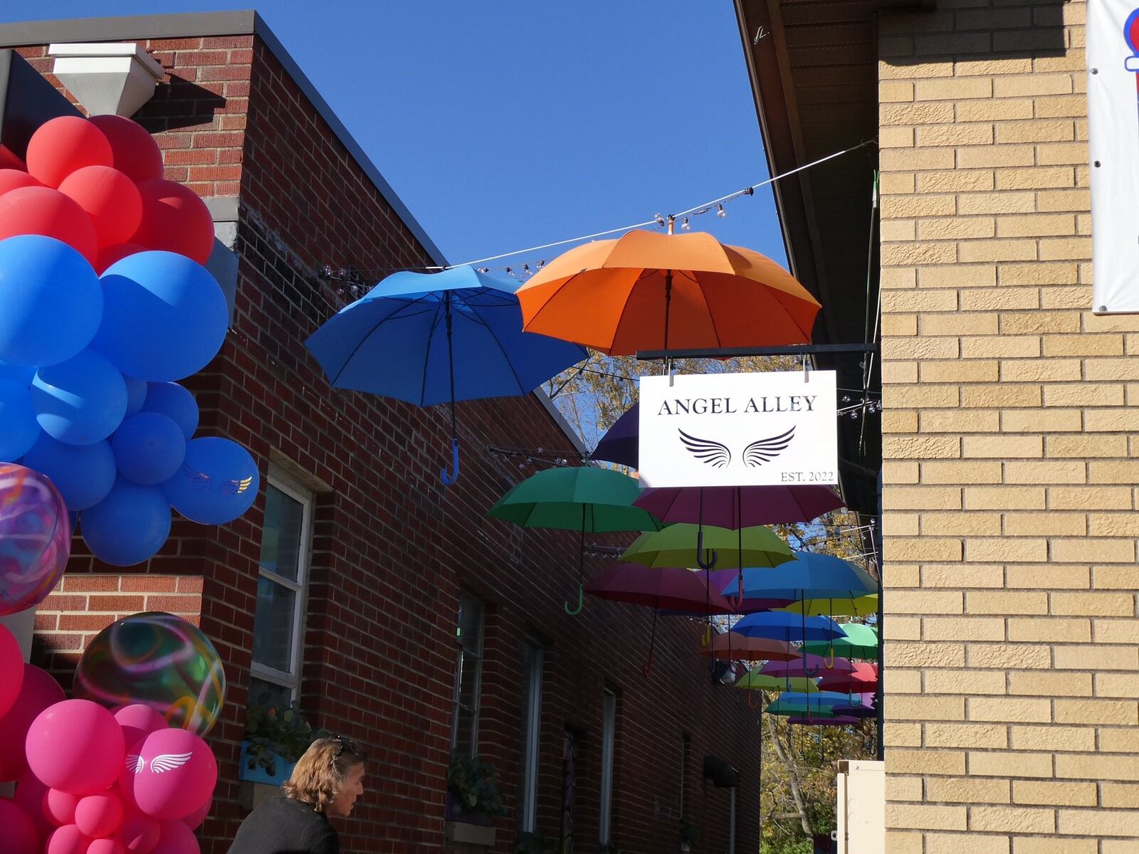 Families, friends and neighbors of Mason children gone too soon gathered on Oct. 28 for a dedication ceremony and ribbon-cutting of Angel Alley, a memorial to those preschool through college age residents who have passed away. JON WEIDLICH/CONTRIBUTOR