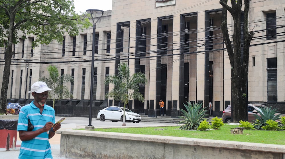 FILE - The country's coat of arms is displayed on the facade of a government building in Port-of-Spain, Trinidad and Tobago, Aug. 20, 2024. (AP Photo/Ash Allen, File)