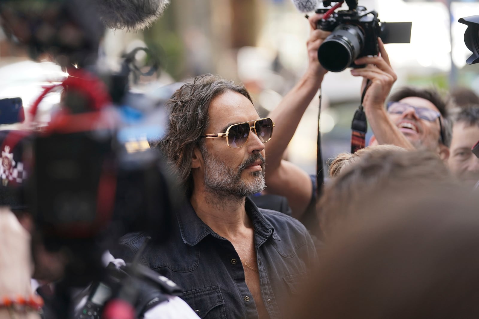 Actor--comedian Russell Brand arrives at Westminster Magistrates' court in London, Friday, May 2, 2025, to face charges of rape and sexual assault involving four women. (AP Photo/Alberto Pezzali)