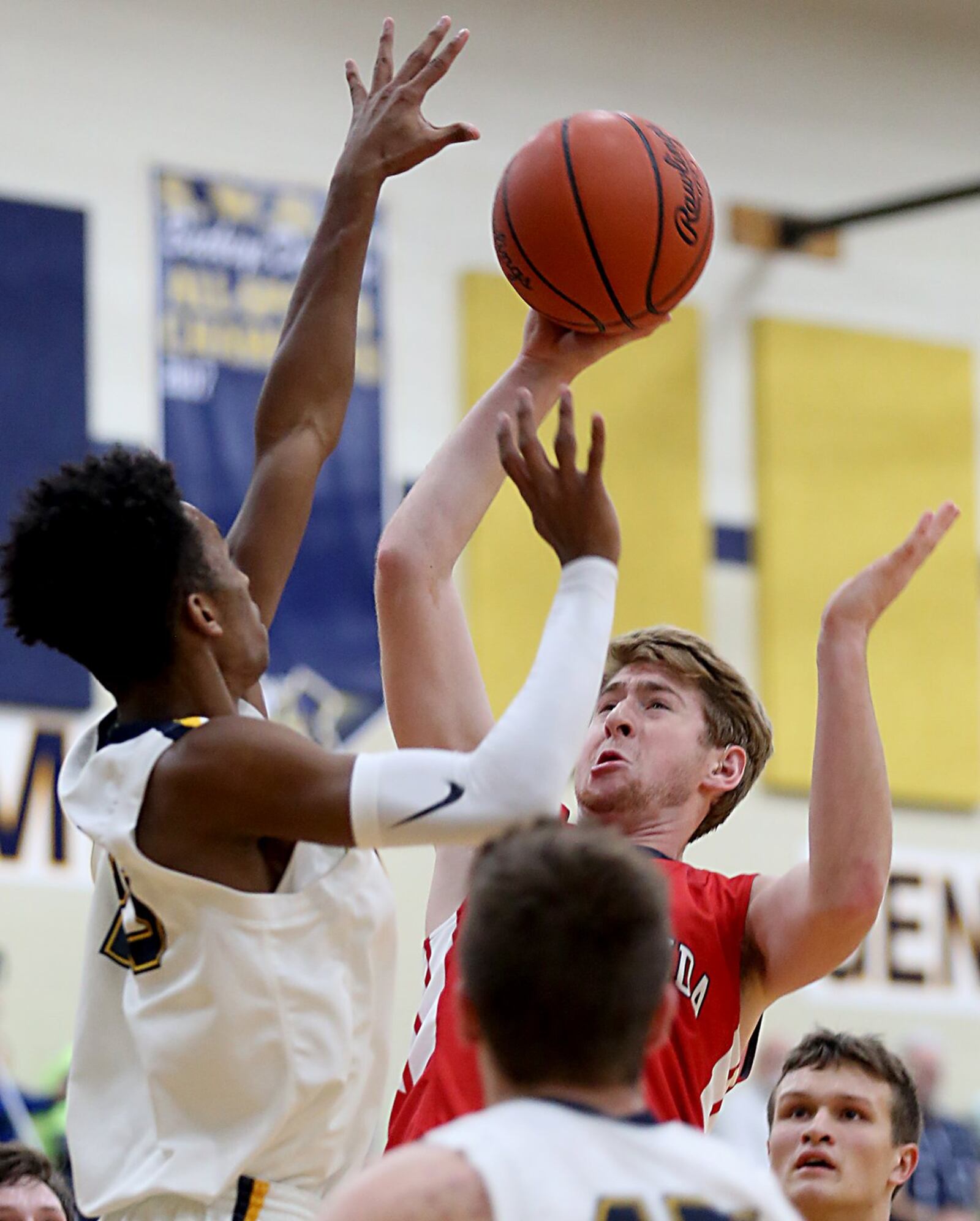 Talawanda’s Evan James has his shot knocked away by Monroe forward Tristan Backas during their game at Monroe on Tuesday night. CONTRIBUTED PHOTO BY E.L. HUBBARD
