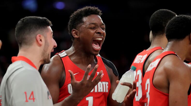 NEW YORK, NY - JANUARY 20: Jae'Sean Tate #1 of the Ohio State Buckeyes cheers from the sideline against the Minnesota Golden Gophers in the second half during their game at Madison Square Garden on January 20, 2018 in New York City. (Photo by Abbie Parr/Getty Images)