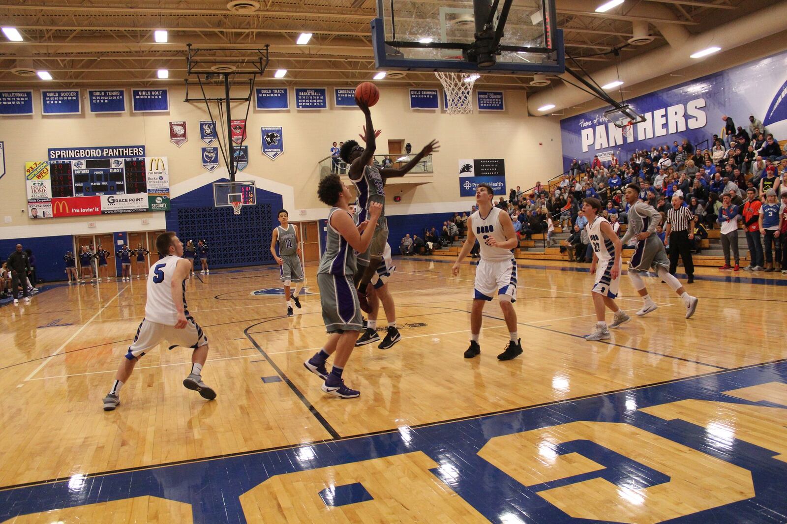 Middletown’s Jomar Bailey (35) goes up for a layup as Springboro’s Kaleb Tabor (5), Nick Pluta (3) and Connor Grevey (23) watch during Saturday night’s game at Springboro. CONTRIBUTED PHOTO BY MARITZA MCKINNEY