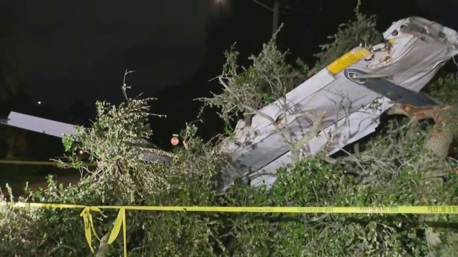 This image taken from video provided by CBS News Miami shows the wreckage of a small plane that crashed in Pembroke Pines, Fla., Monday, July 14, 2025. (CBS News Miami/WFOR via AP)