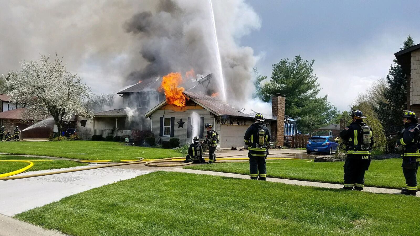 Hamilton, Ross Twp. and Fairfield firefighters battle a structure fire in the 400 block of Beeler Boulevard on Hamilton’s West Side Friday, April 27, 2018. 