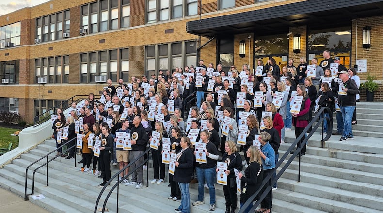 Over 100 Ross Local Schools teachers gather for a rally Wednesday, Nov. 5 while contract mediation talks are going on inside the Ross Local Schools Administrative Offices. NICK GRAHAM/STAFF