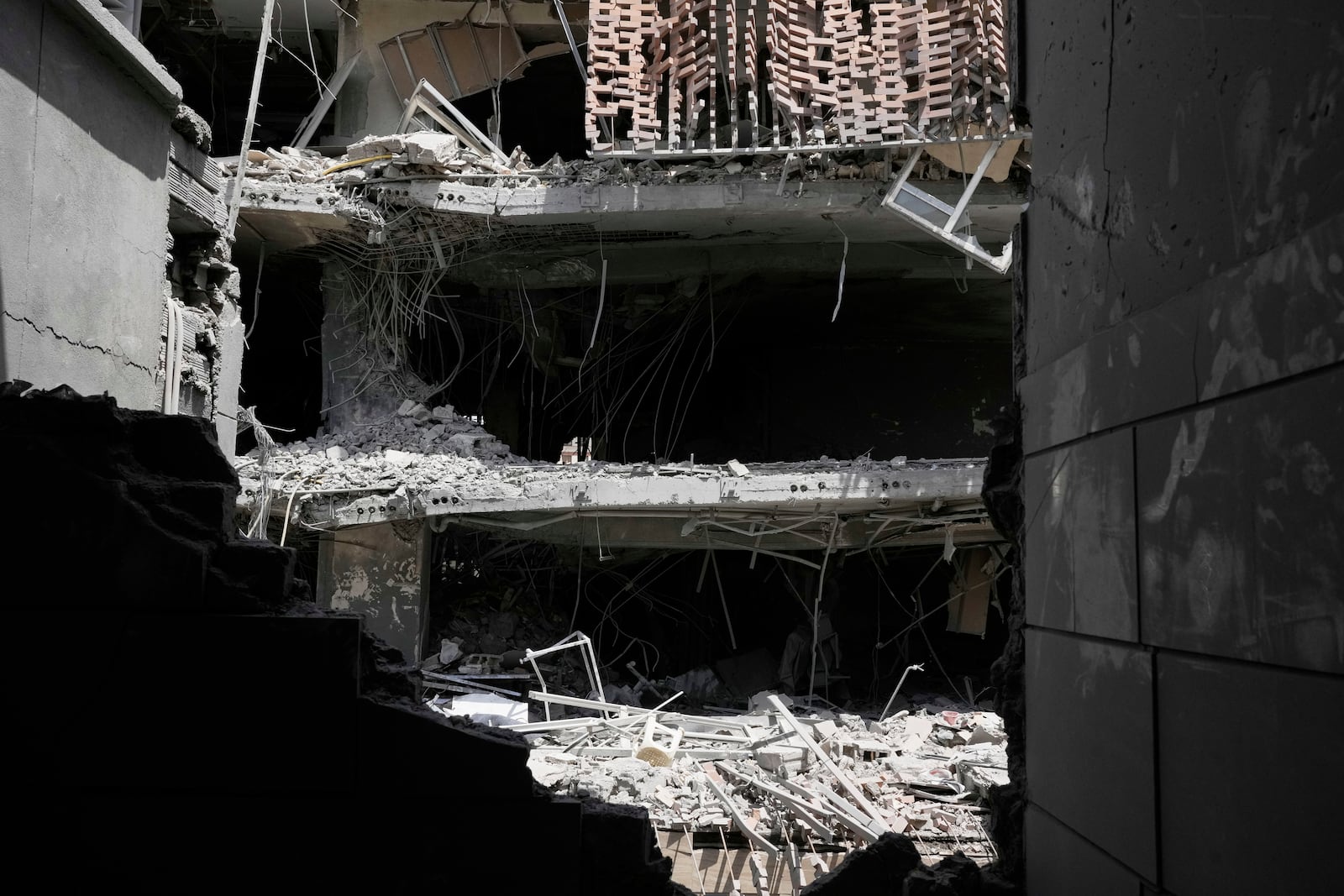 Damages are seen in buildings after an Israeli strike last week, in Tehran, Iran, Wednesday, June 25, 2025. (AP Photo/Vahid Salemi)