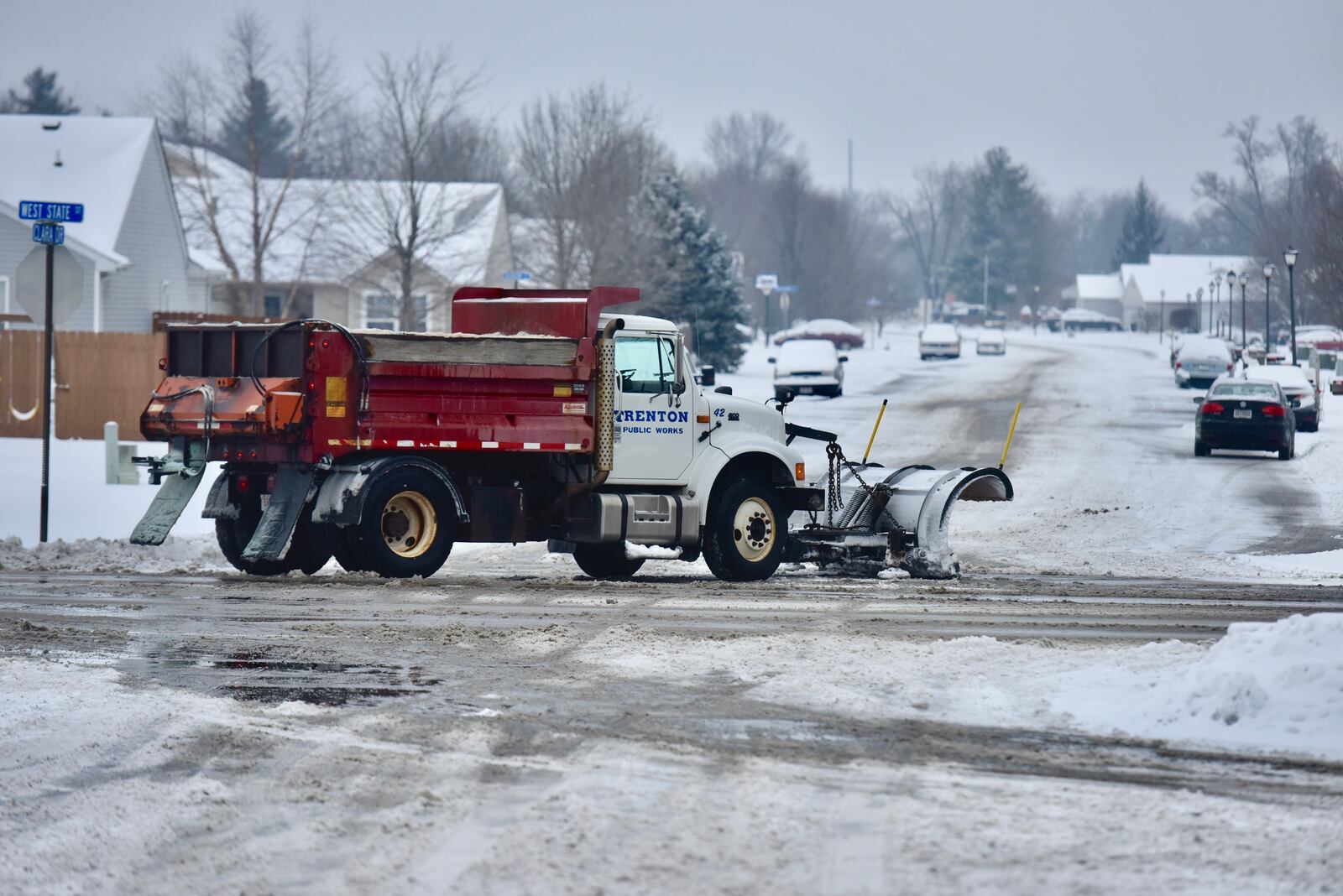 A Trenton plow truck clears snow at West State Street and Clara Drive in Trenton. NICK GRAHAM / STAFF
