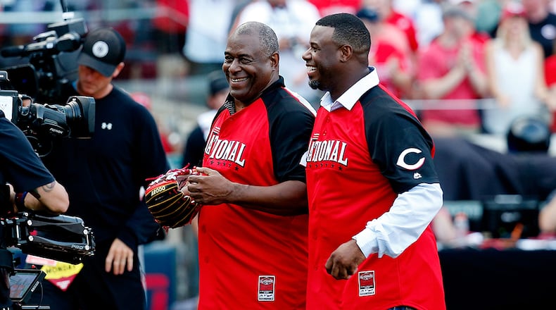 Ken Griffey Jr. speaks with his father Ken Griffey Sr. after throwing out the first pitch prior to the Home Run Derby at the Great American Ball Park on July 13, 2015, in Cincinnati. FILE PHOTO