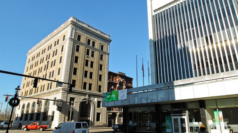 The former First National Bank Building at 2 N. Main St., at left, that was donated by the city of Middletown to Cincinnati State in 2012 is the focus of a controversy with Art Central Foundation. Cincinati State had planned to transfer the building to the local nonprofit for redevelopment. However, city officials objected saying they wanted the property back from the college for redevelopment. City and Art Central Foundation officials are discussing a possible resolution. FILE PHOTO