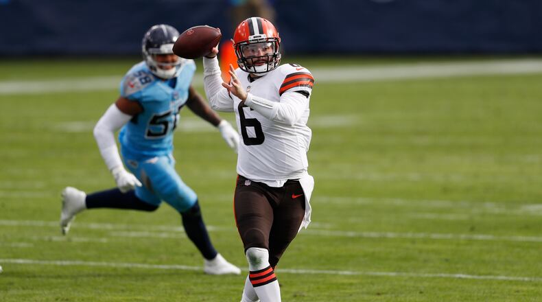 Cleveland Browns quarterback Baker Mayfield (6) throws as he scrambles against the Tennessee Titans in the first half of an NFL football game Sunday, Dec. 6, 2020, in Nashville, Tenn. (AP Photo/Wade Payne)