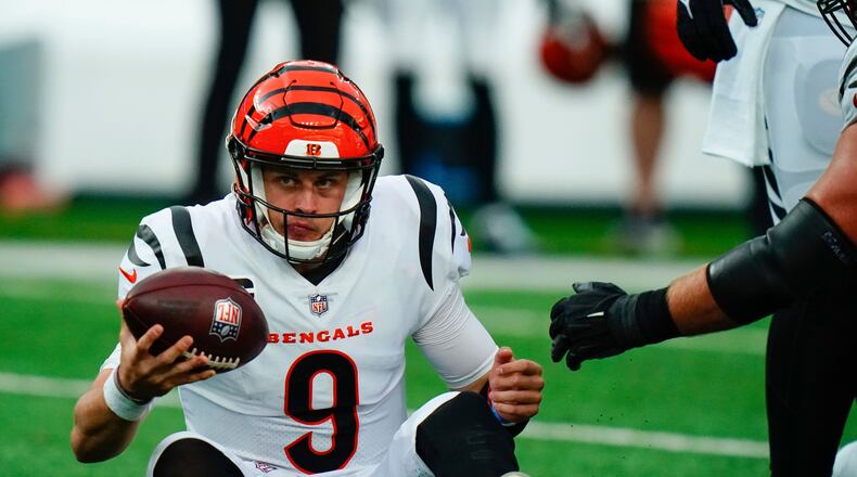 Cincinnati Bengals quarterback Joe Burrow reacts as he sits on the ground during the second half of an NFL football game against the New York Jets, Sunday, Oct. 31, 2021, in East Rutherford, N.J. (AP Photo/Frank Franklin II)