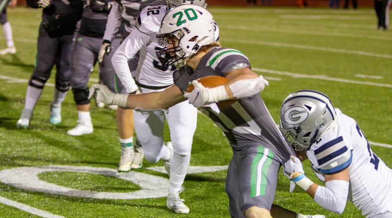 Badin running back Jack Walsh stretches for extra yards Friday against Granville at London High School in the Division III semifinals. Walsh rushed for 226 yards and two touchdowns on 43 carries. Jeff Gilbert/CONTRIBUTED