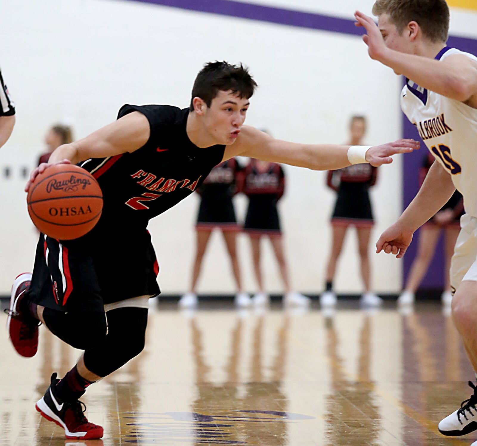 Franklin guard Payton Knott tries to drive on Bellbrook guard Ethan Savey during their game at Bellbrook on Friday night. CONTRIBUTED PHOTO BY E.L. HUBBARD