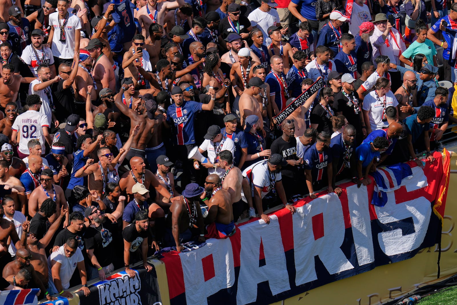 Paris Saint-Germain fans cheer during the Club World Cup semifinal soccer match between PSG and Real Madrid in East Rutherford, N.J., Wednesday, July 9, 2025. (AP Photo/Pamela Smith)