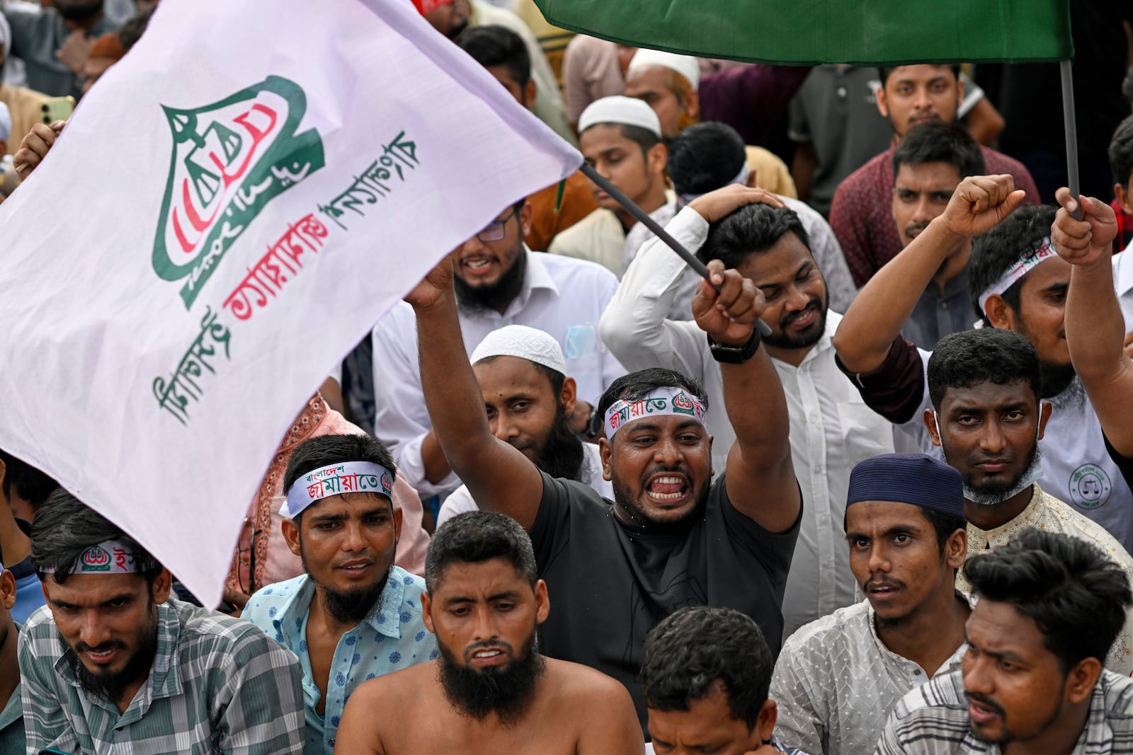 Supporters of Bangladesh's largest Islamist party Jamaat-e-Islami attend a rally in a show of strength ahead of elections expected next year, in Dhaka, Bangladesh, Saturday, July 19, 2025. (AP Photo/Mahmud Hossain Opu)