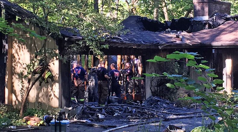 Middletown Division of Fire investigates the scene of a fire that broke out around 6:30 a.m. Sept. 19, 2016, in the 1900 block of Court Donegal and caused approximately $400,000 in damages. RICK McCRABB/STAFF