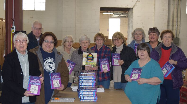 The Altrusa International Club of Hamilton, a non-profit established in 1923, received a $4,000 grant for two literacy programs in Butler County from the Altrusa International Foundation of Chicago. Pictured, from left to right: Joan Witt, Mary Kuenzig, (Mark Kuenzig not a member but helper), Janis Kowalski, Carol Bondoc, Mary Jane Mayer, Anita Harper, Germaine Vonderhaar, Kathy Carmack, Nancy Schwab, Bobbi Hesselgrave. Current Members missing that day: Margie Anderson, Sr. M. Pascaline Colling, Dana Enrico, Kathy Jackson, Peggy Jung, Joann Koch, Sue Sepela, Meg Witt. CONTRIBUTED