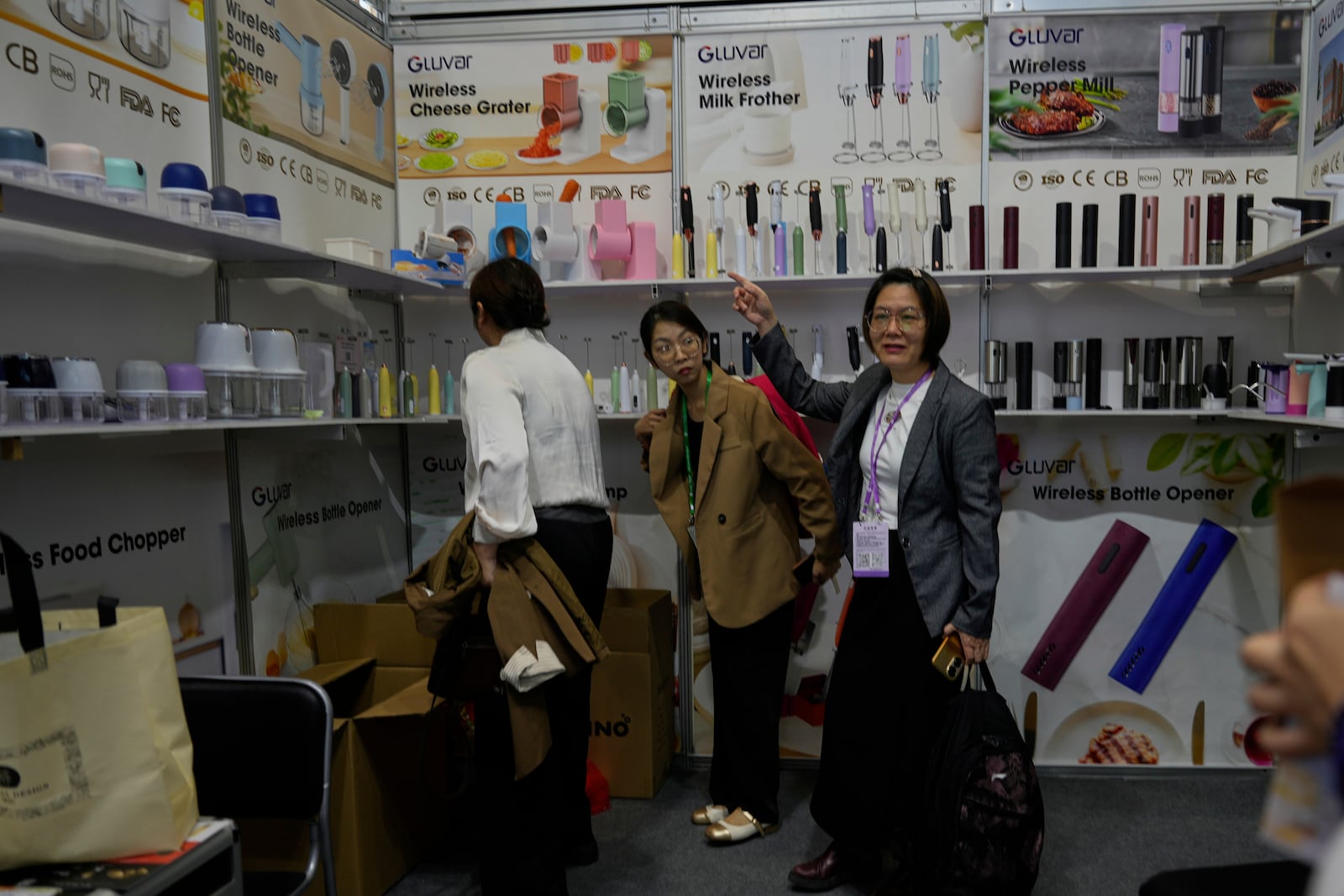 Visitors look at household appliances at the 137th Canton Fair in Guangzhou in southern China's Guangdong province on Wednesday, April 16, 2025. (AP Photo/Ng Han Guan)