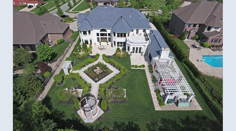 A 6,586-square-foot home at 7036 Southampton Lane in West Chester Twp. is listed at $1,249,000 and includes five bedrooms and 5 1/2 baths. There's also a grand entertaining and family living area with formal aristocratic gardens, a large customer gourmet kitchen and a walk-in cooler. CONTRIBUTED