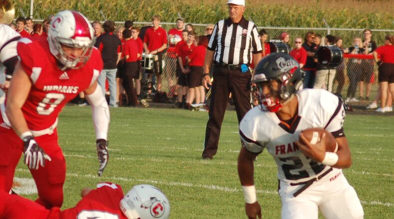 Franklin’s Ryan Montgomery turns the corner on Carlisle during Friday’s game at Laughlin Field in Carlisle. Montgomery scored four touchdowns in the Wildcats’ 47-14 win. CONTRIBUTED PHOTO BY JOHN CUMMINGS