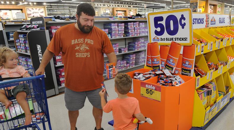Mark Gunton with his childern Monica and Drew was shopping for school supplies at the Meijer Store on Wilmington Pike on Friday, July 30, 2021. MARSHALL GORBY\STAFF