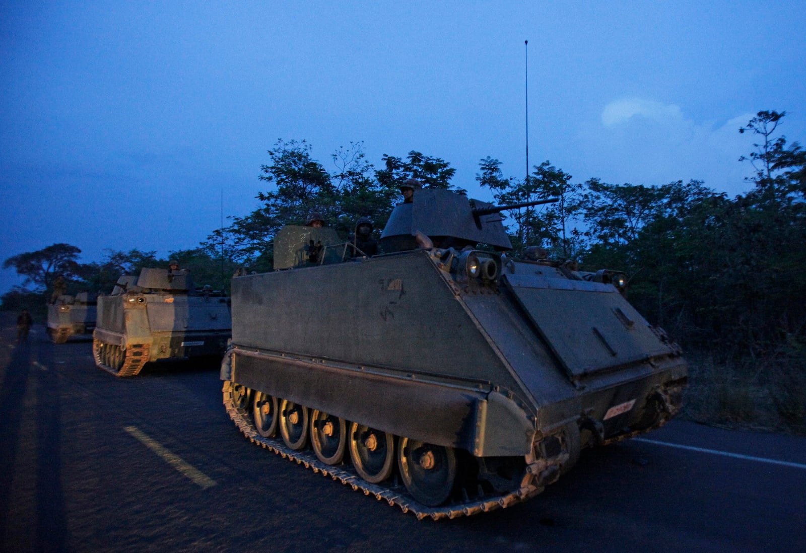 FILE- Thai soldiers on armored personnel carriers take a position at the border during fighting between Thailand and Cambodia in Surin province, northeastern Thailand Tuesday, April 26, 2011. (AP Photo/Sakchai Lalit, File)