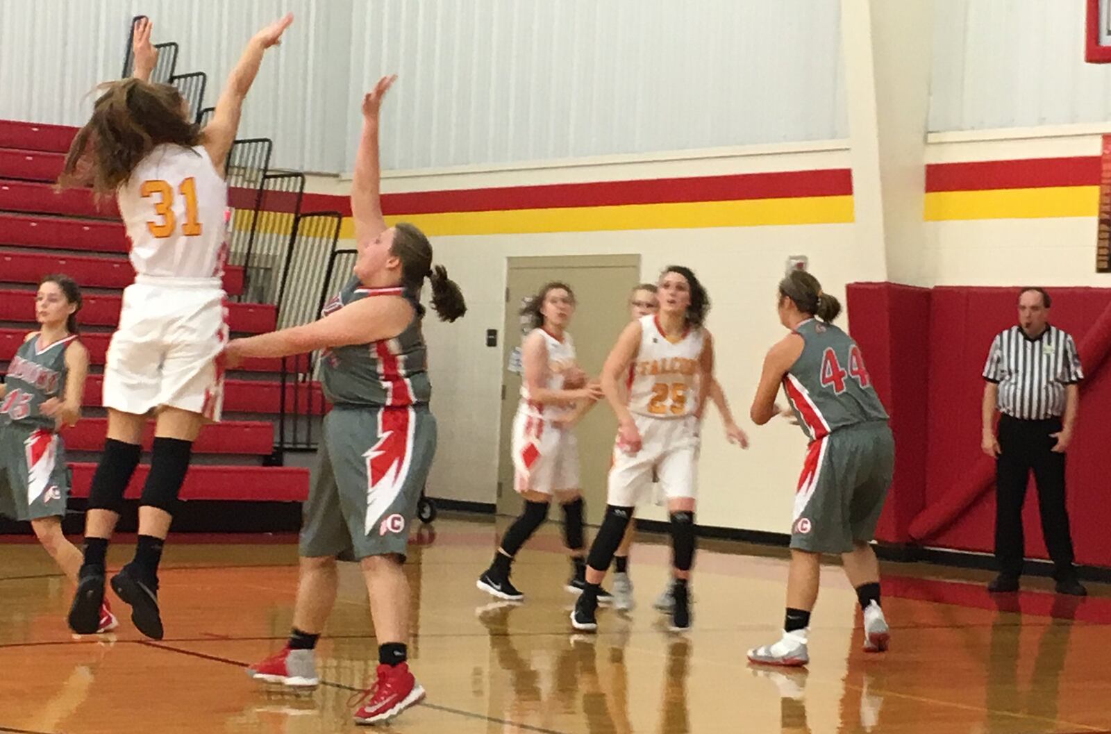 Fenwick’s Emily Adams (31) follows through with a shot over Carlisle’s Katelynn Moore (50) during Wednesday night’s game at Fenwick. RICK CASSANO/STAFF