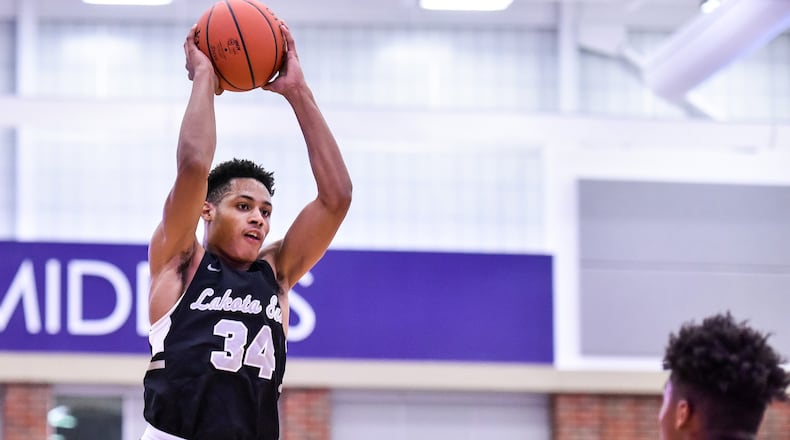 Lakota East’s Nate Johnson jumps up to make a pass during a Jan. 8 game against Middletown at Wade E. Miller Arena. Visiting East won 61-47. NICK GRAHAM/STAFF