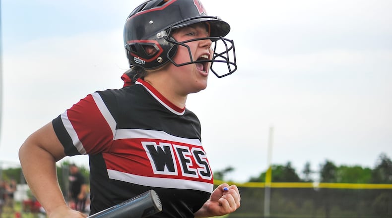 Lakota West’s Corey Weaver celebrates a run during a Division I district softball final against Fairfield on Friday at Lakota East. West won 8-2. NICK GRAHAM/STAFF