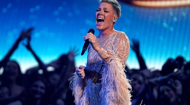 Pink performs "Hopelessly Devoted To You" during a tribute to the late singer Olivia Newton-John at the American Music Awards on Sunday, Nov. 20, 2022, at the Microsoft Theater in Los Angeles. (AP Photo/Chris Pizzello)
