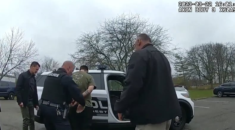 John Carter was arrested Wednesday for the murder of Katelyn Markham. Video shows Carter in handcuffs being patted down by officers before he’s put in the back of a police cruiser. A camera inside the police cruiser shows Carter sitting in the back of a cruiser. CONTRIBUTED