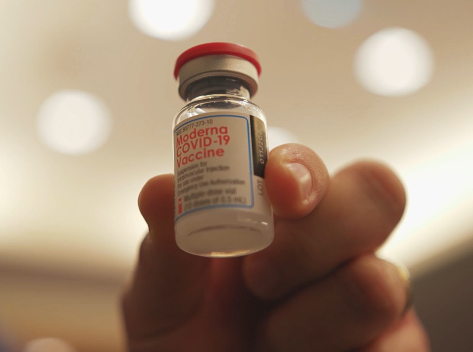 Pictured is a person from The Christ Hospital in Cincinnati holding up a bottle on Dec. 22, 2020, of the first dose of the Moderna COVID-19 vaccine. The Cincinnati hospital, which has a campus in Liberty Twp. in Butler County, Ohio, received 2,500 doses on Dec. 22. PROVIDED/THE CHRIST HOSPITAL