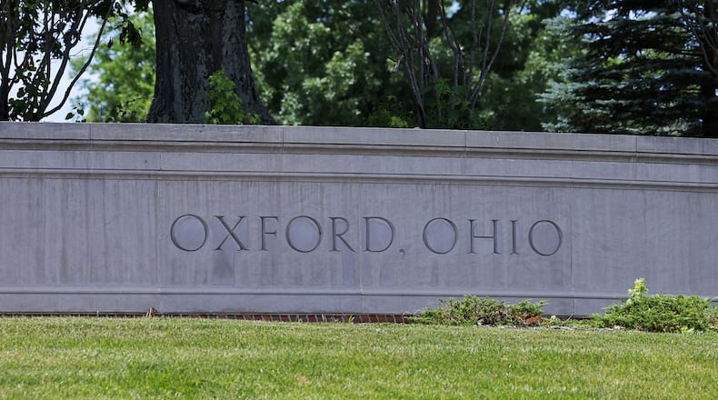 A sign welcomes visitors as they enter Oxford. NICK GRAHAM/STAFF