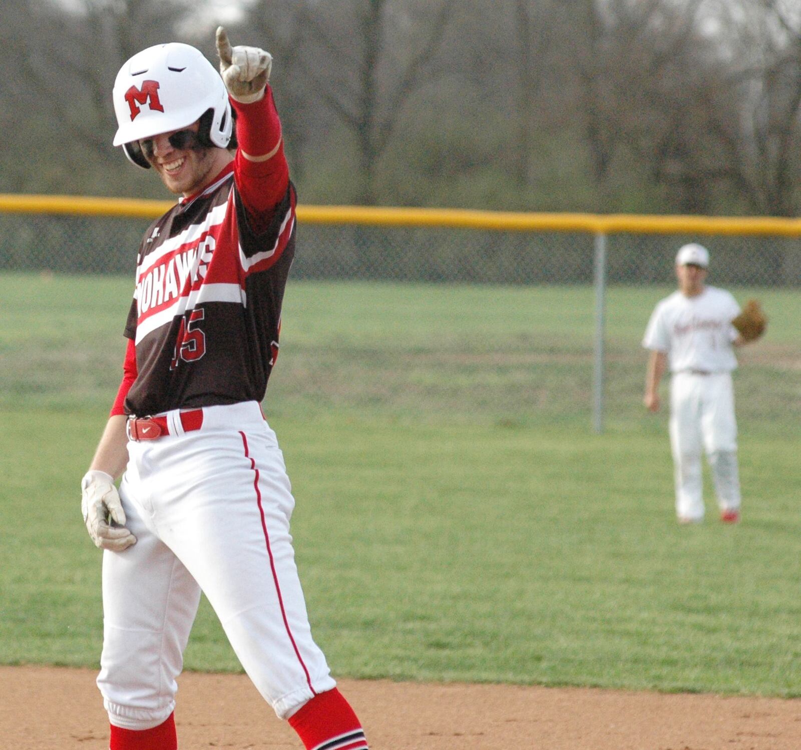 Madison’s Luke Hughes reacts after plating the only run Monday as the visiting Mohawks defeated Carlisle 1-0 in a Southwestern Buckeye League baseball game at Sam Franks Field. RICK CASSANO/STAFF