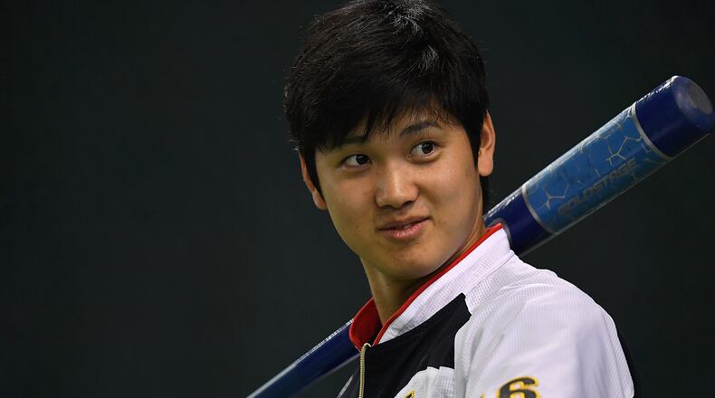 TOKYO, JAPAN - NOVEMBER 12:  Shohei Ohtani #16 of Japan is seen during the warm-up ahead of the international friendly match between Japan and Netherlands at the Tokyo Dome on November 12, 2016 in Tokyo, Japan.  (Photo by Masterpress/Getty Images)