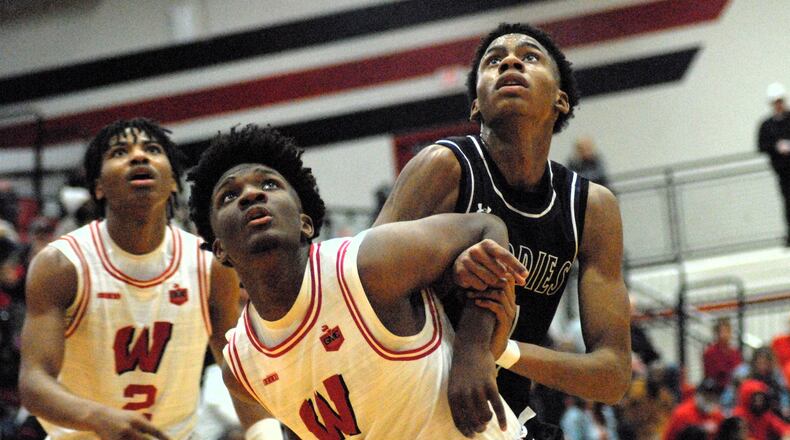 Lakota West's Hakeem Smith (4) and Middletown's Chandler Shields fight for position during a free throw on Friday night. Chris Vogt/CONTRIBUTED