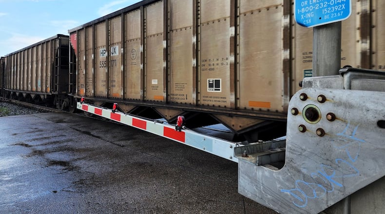 A CSX train travels along the railroad tracks crossing Laurel Avenue Tuesday, July 5, 2022 in Hamilton. Hamilton officials had a meeting last week with CSX officials. The train officials said they would work with city leaders the best they could, but there is not much they can do about blocking railroad crossing. They did recommend motorists to call a toll-free number that's posted at every crossing if there are problems, including stopped trains. NICK GRAHAM/STAFF
