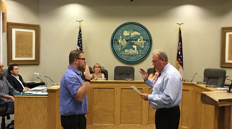 William Bicknell (left) is sworn-in by Carlisle Mayor Randy Winkler as a member of Carlisle Village Council on Sept. 12. Bicknell was appointed to complete the unexpired term of Councilman Jake Fryman, who resigned effective Sept. 16. Bicknell is one of five people seeking one of the four open seats on council this fall. CONTRIBUTED