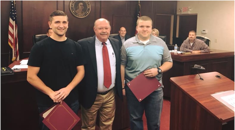 Franklin City Council presented the city’s Good Neighbor Award to two Zink’s Meat Market employees on Monday. Adam Myers (left) and Corey Davis (right) performed the Heimlich maneuver on a customer who was choking inside the store. They are pictured with Franklin Mayor Denny Centers. CONTRIBUTED/CITY OF FRANKLIN
