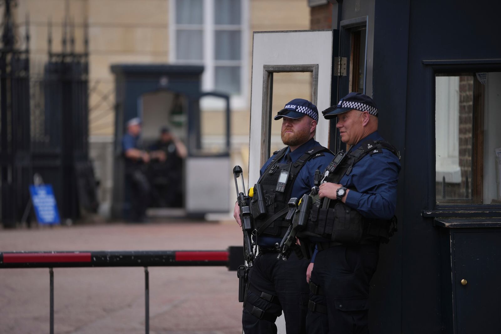 Police officers stand guard at the entrance of Lancaster House, where the trade talks between the U.S. and China are taking place, in London, Monday, June 9, 2025. (AP Photo/Kin Cheung)