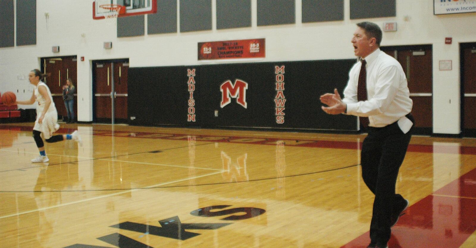 Madison coach Brian McGuire cheers for his team during Thursday night’s 50-39 loss to visiting Monroe. RICK CASSANO/STAFF