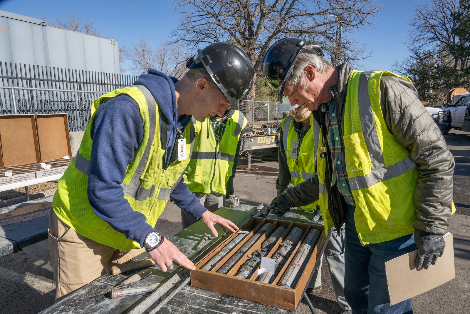 This undated photograph provided by the Denver Museum of Nature and Science shows James Hagadorn, left and Bob Raynolds examining a drilling core from the City Park core drilling in the parking lot at Denver Museum of Nature and Science. (Richard M Wicker/Denver Museum of Nature and Science via AP)
