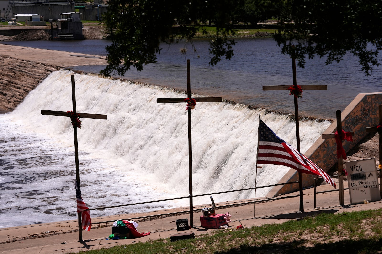 Crosses were erected as a memorial for victims of the flash flood along the Guadalupe River in Kerrville, Texas, Thursday, July 10, 2025. (AP Photo/Gerald Herbert)