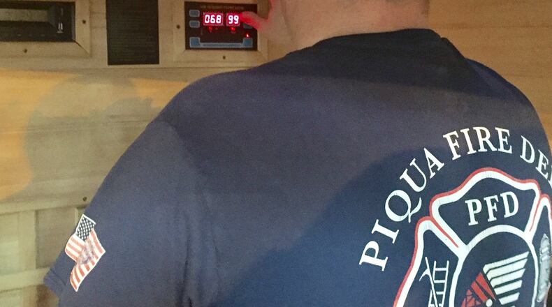 Piqua firefighter Brad Weer shows off the fire department’s sauna. Using the sauna is one way firefighters get rid of smoke and other contaminants they come into contact with when fighting fires. STEVE BAKER