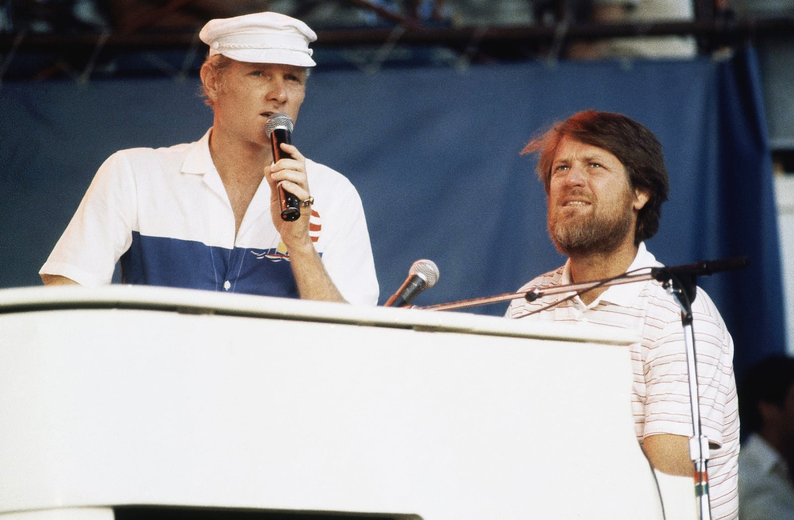 FILE - Mike Love, left, and Brian Wilson of The Beach Boys, perform at the Miller Time concert on Pier 84 on July 8, 1983 in New York. (AP Photo/ David Handschuh, File)