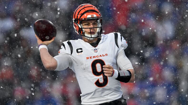 Cincinnati Bengals quarterback Joe Burrow (9) passes against the Buffalo Bills during the third quarter of an NFL division round football game, Sunday, Jan. 22, 2023, in Orchard Park, N.Y. (AP Photo/Adrian Kraus)