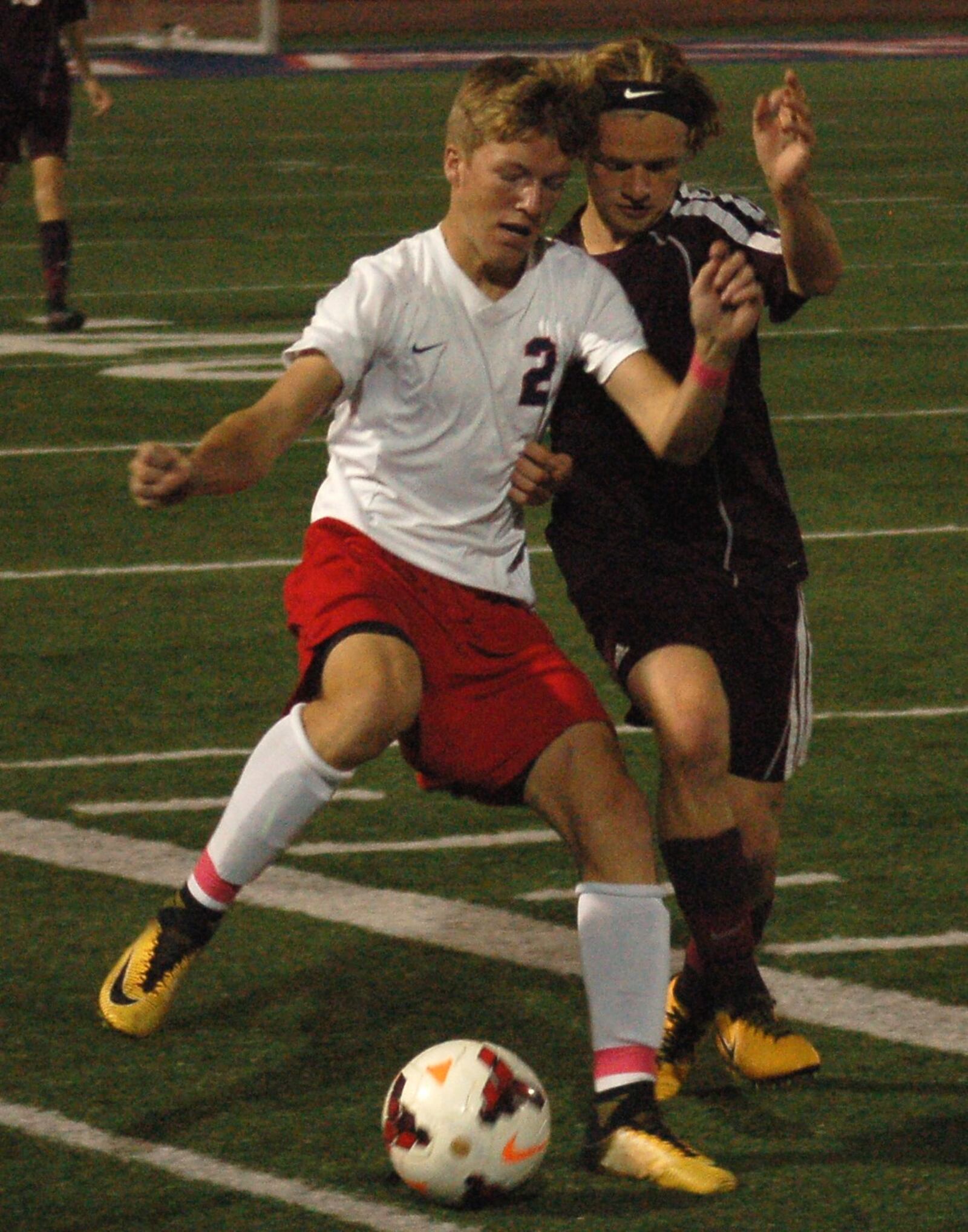 Talawanda’s Tristan Fontaine (left) battles Jake Gentry of Ross for the ball during Thursday night’s game in Oxford. CONTRIBUTED PHOTO BY JOHN CUMMINGS
